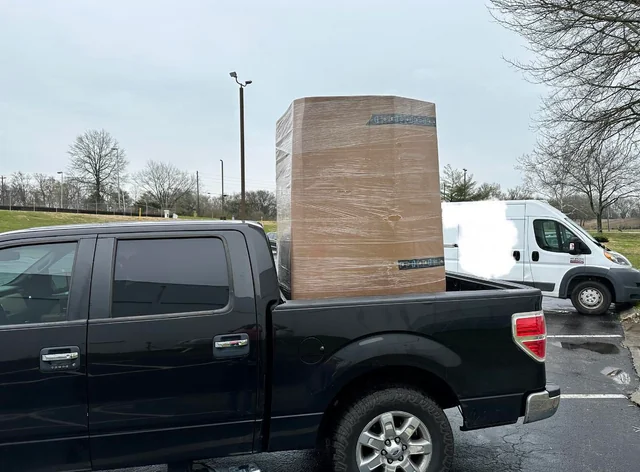Pickup truck loaded with a wrapped pallet